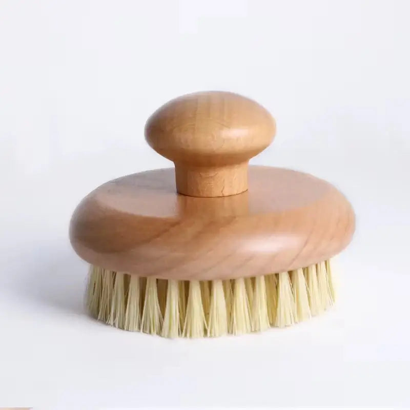 Wooden brush with bristles on a white background
