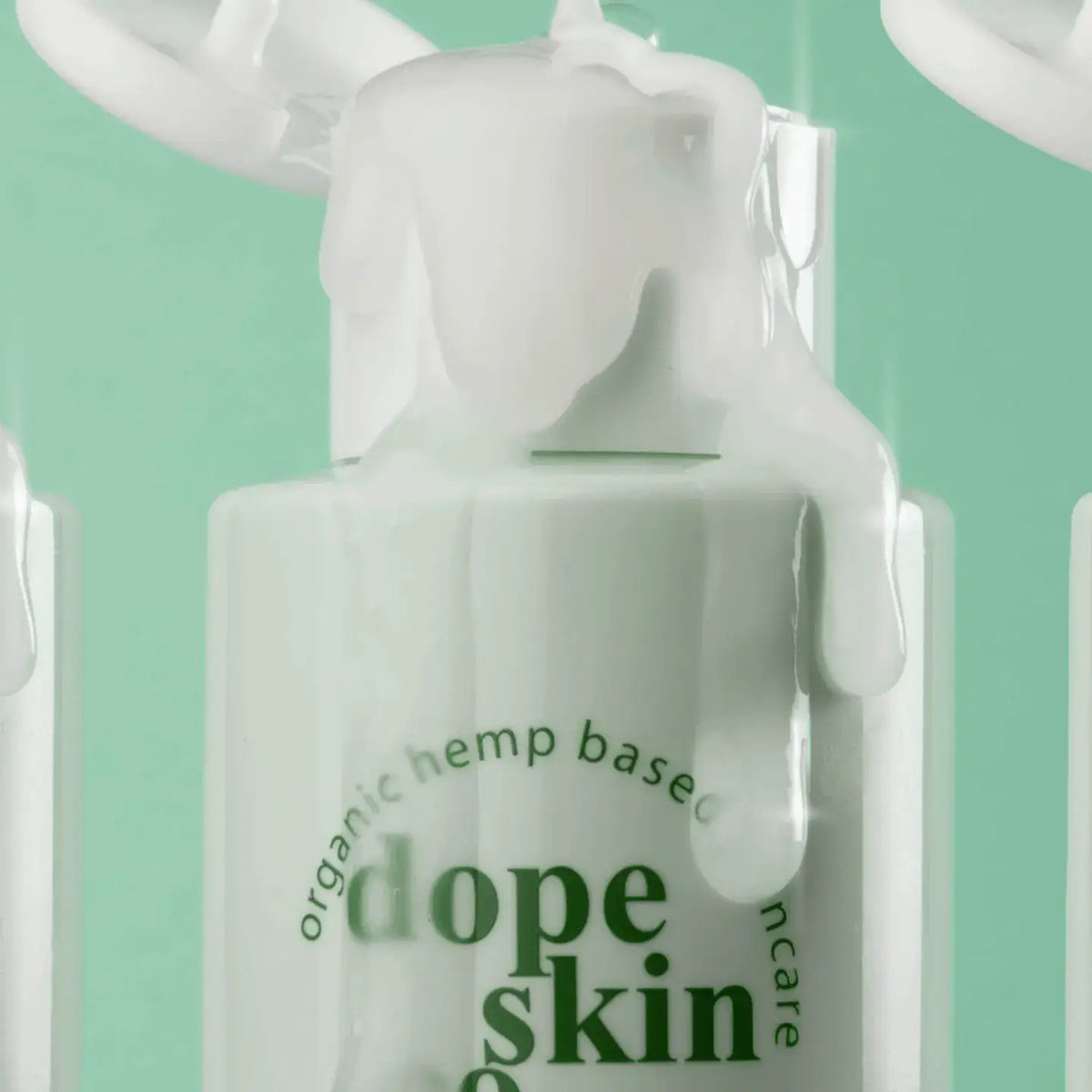 Bottle of 'dope skin' skincare product with green text on a light green background