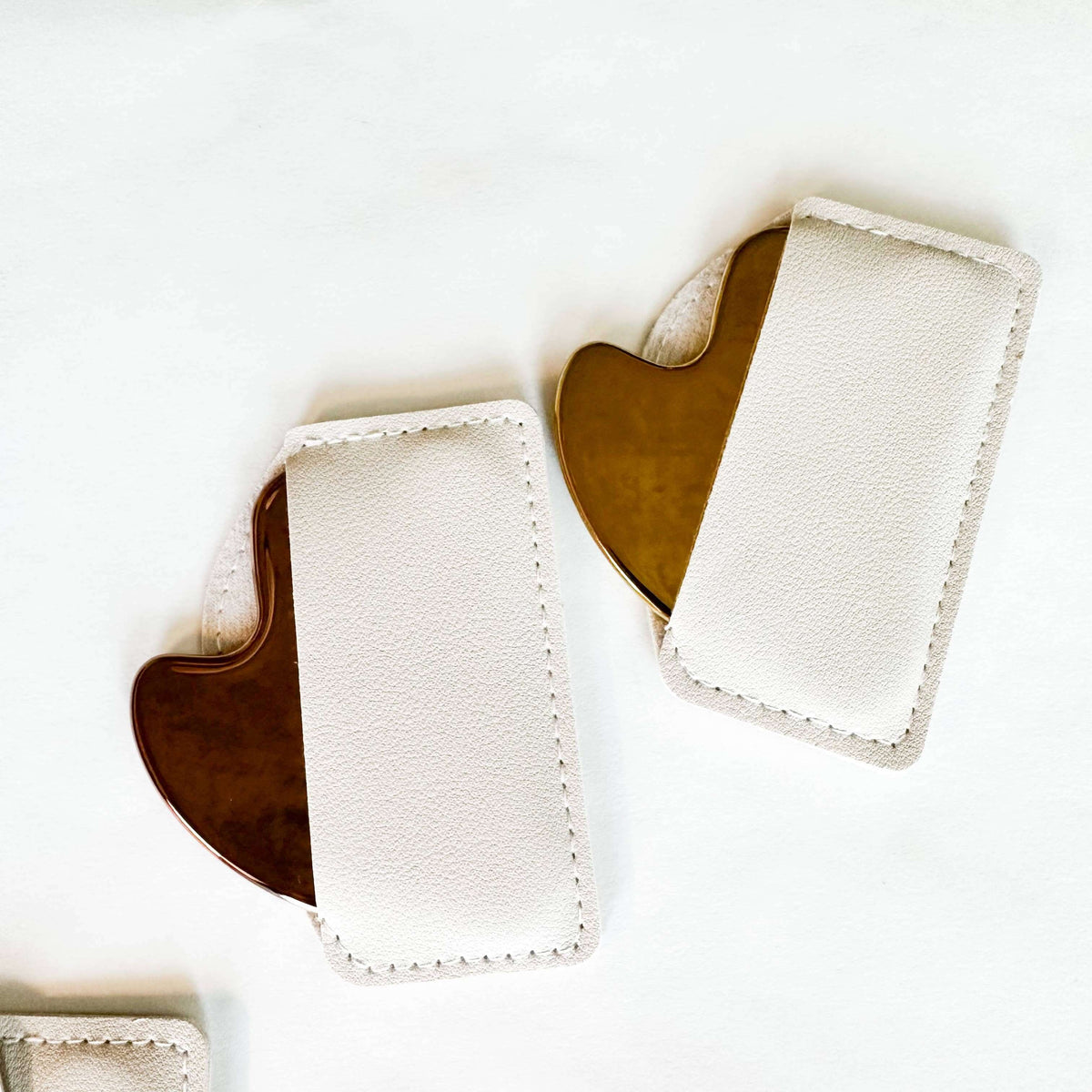 White phone case with brown accents on a white background