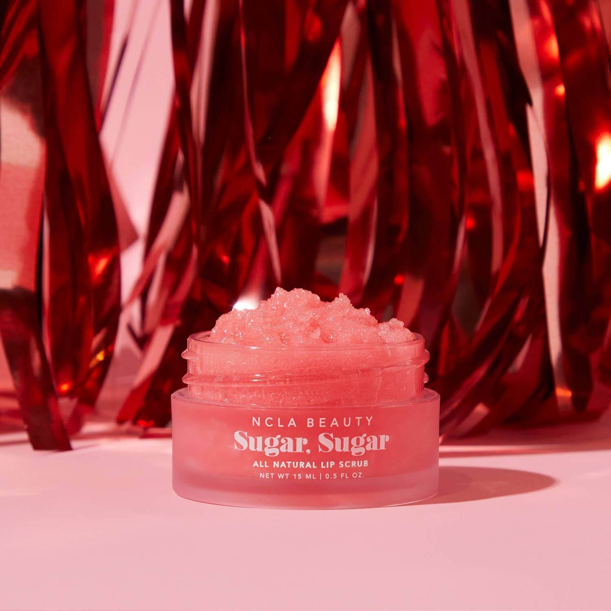 NCLA Beauty Sugar, Sugar lip scrub jar with red metallic background