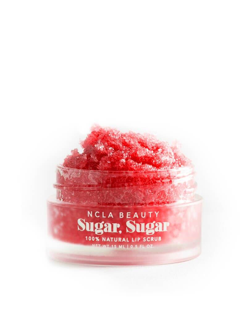 NCLA Beauty Sugar Sugar lip scrub in a clear container on a white background