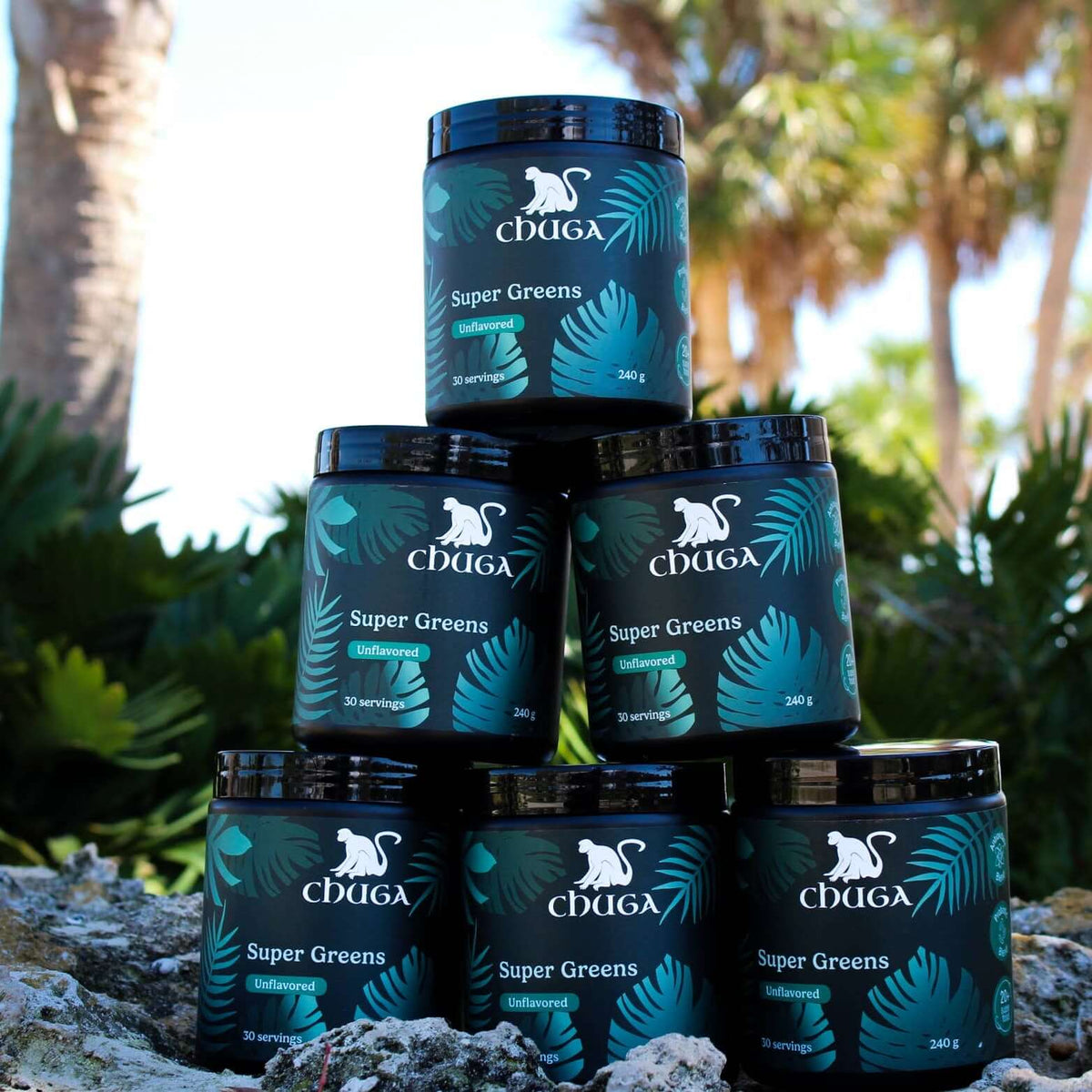 Stack of Super Greens Powder jars front display, highlighting organic super greens powder for health benefits.
