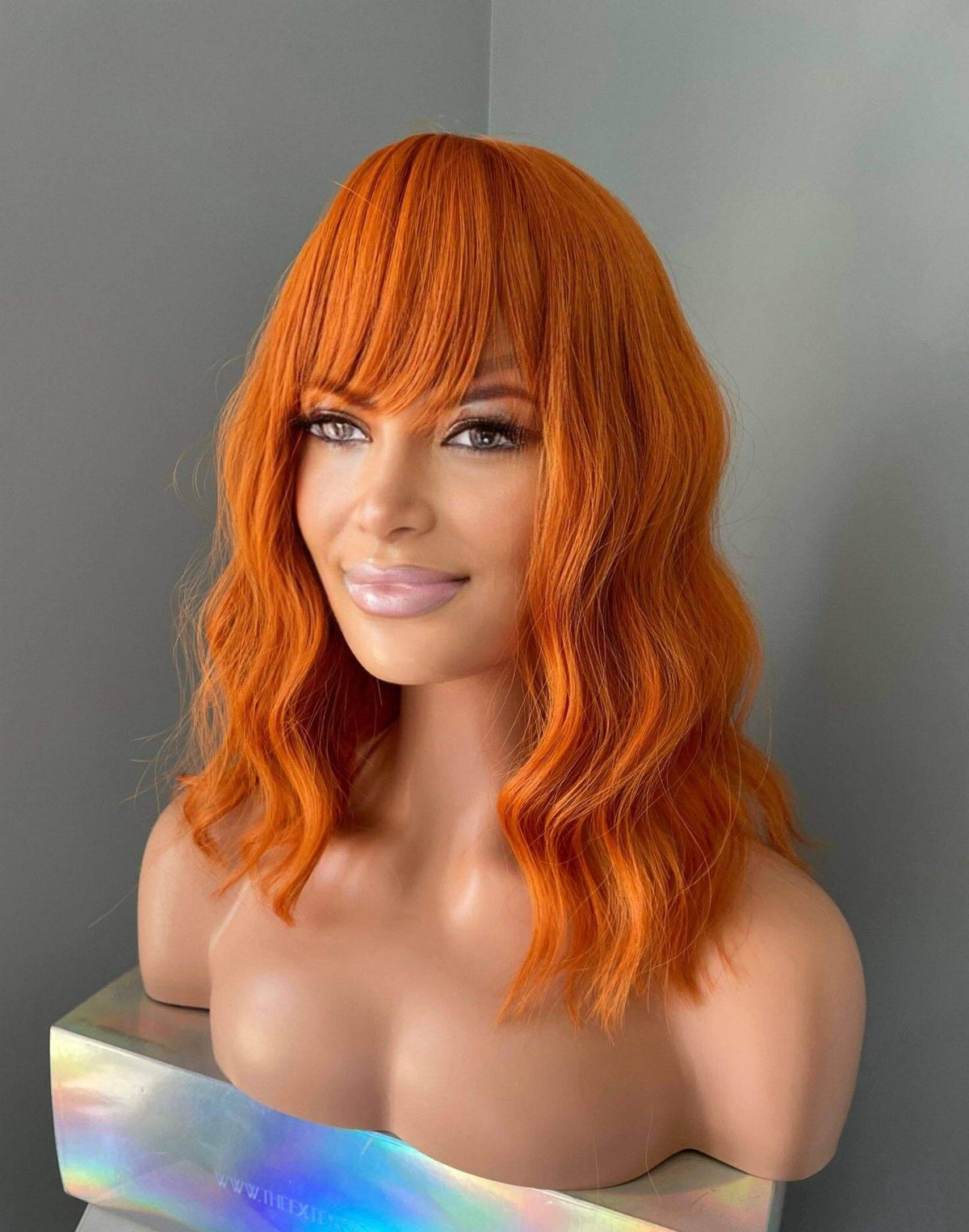 Tangerine Short Orange Wig with Bangs, vibrant hairstyle, bold fashion statement, eye-catching orange color