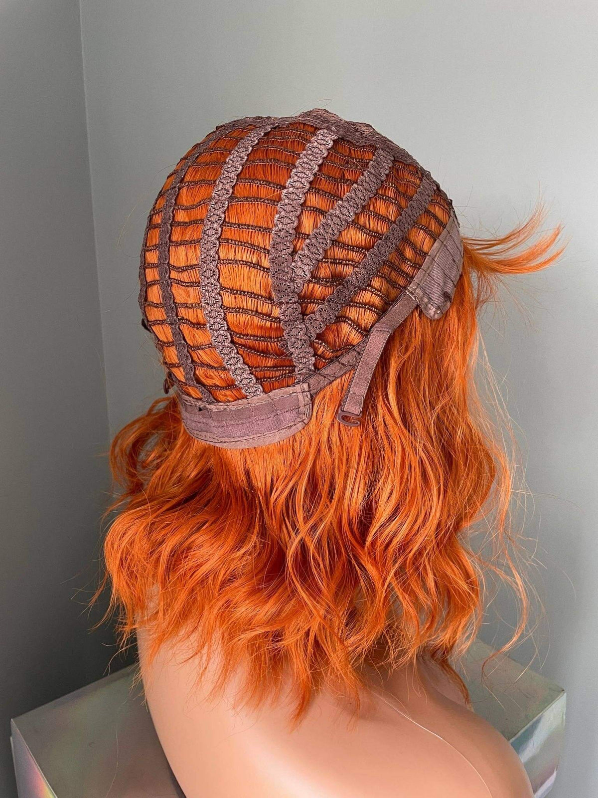 Tangerine Short Orange Wig with Bangs showcasing the back structure and vibrant color.