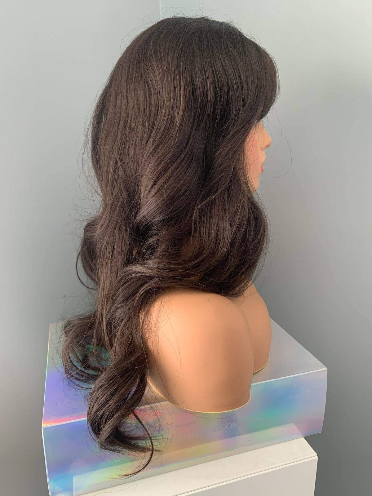 Tasha Long Dark Chocolate Brown Wig with Bangs displaying soft waves and a full fringe on a mannequin.