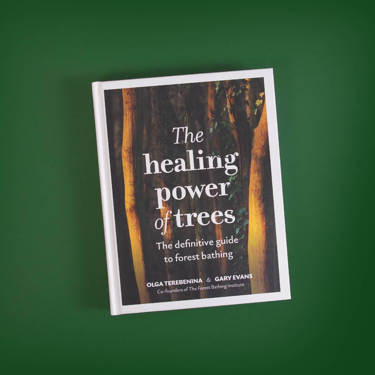 Book titled 'The Healing Power of Trees' on a green background