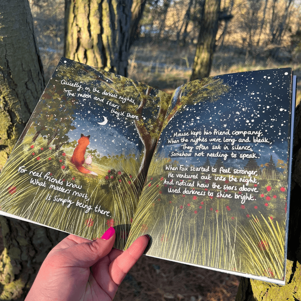 The Longest Night Paperback Book + bookmark open to pages showing Fox and starry night, conveying themes of friendship and grief.