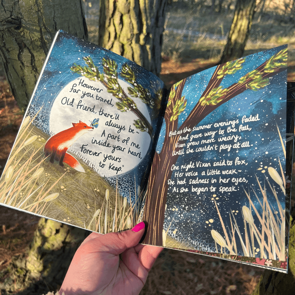 Open pages of The Longest Night Paperback Book + bookmark featuring sensitive illustrations of Fox and Vixen.
