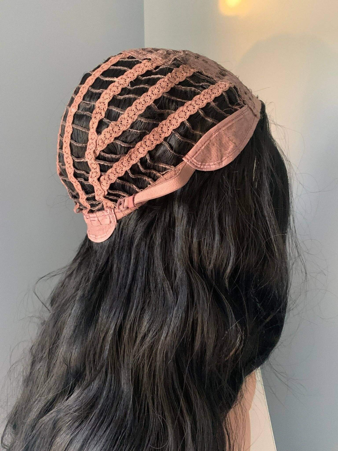 Close-up of the inner cap construction of the Valentina Long Black Soft Waves Wig, showcasing breathable design features.