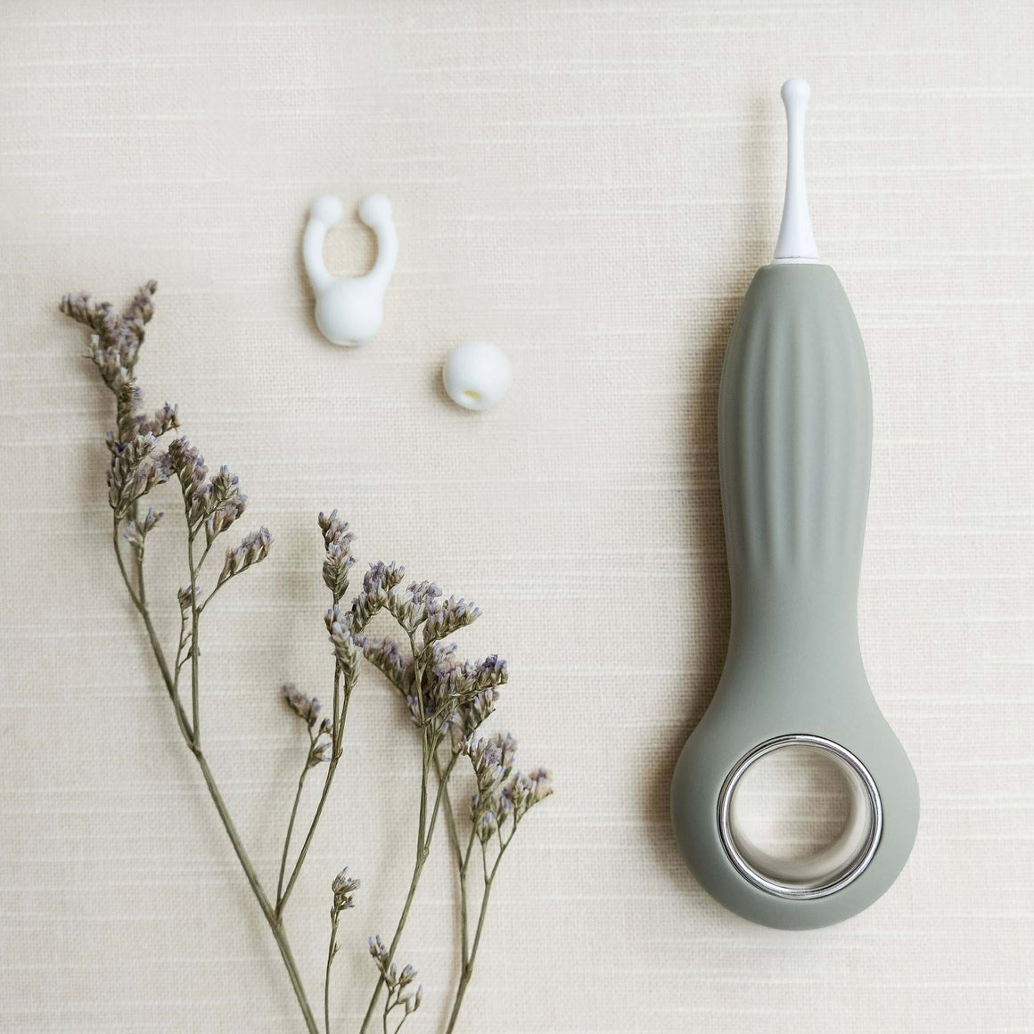Samphire Precision Vibrator with interchangeable heads, ergonomic design, and premium silicone, styled with gentle florals.