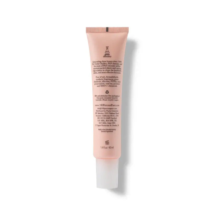 Pink skincare tube with text on a white background
