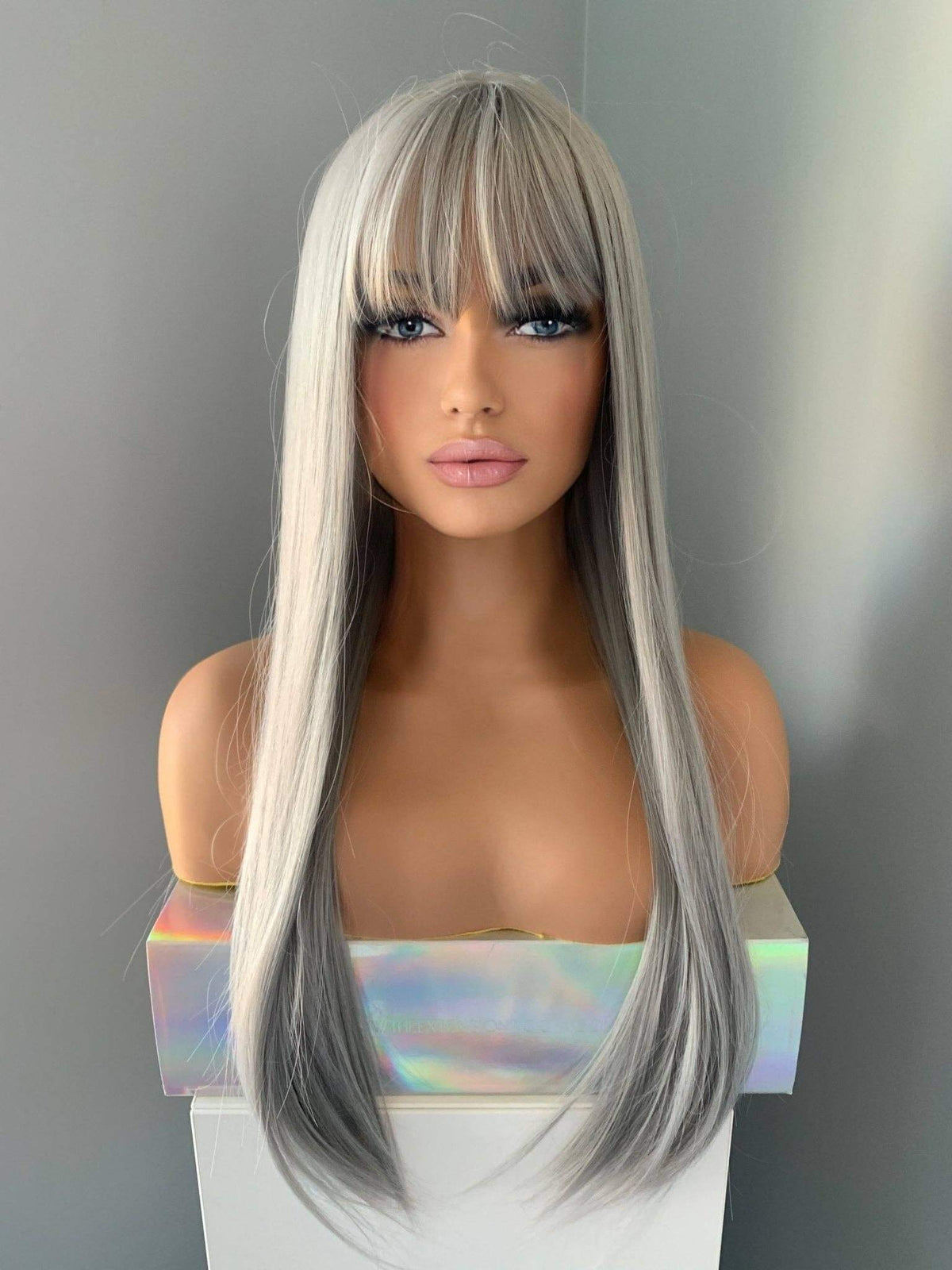 Winny Long Straight Grey Silver Wig with Bangs showcasing a sleek, polished look and featuring the focus keyword Silver Wig.
