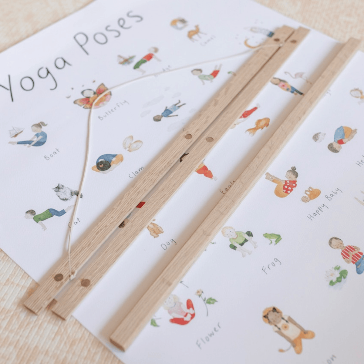 Wooden ruler on a sheet of paper with yoga poses illustrations