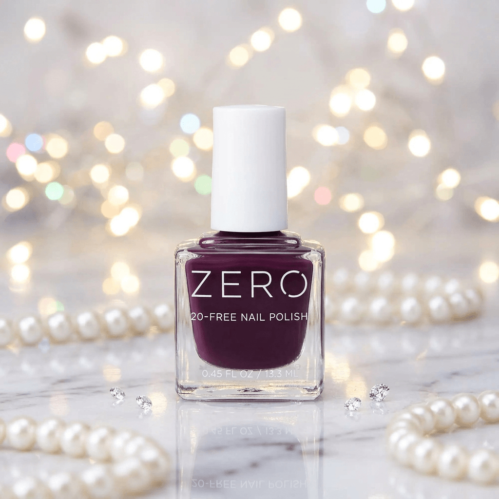 Bottle of ZERO nail polish with a blurred background of lights and pearls