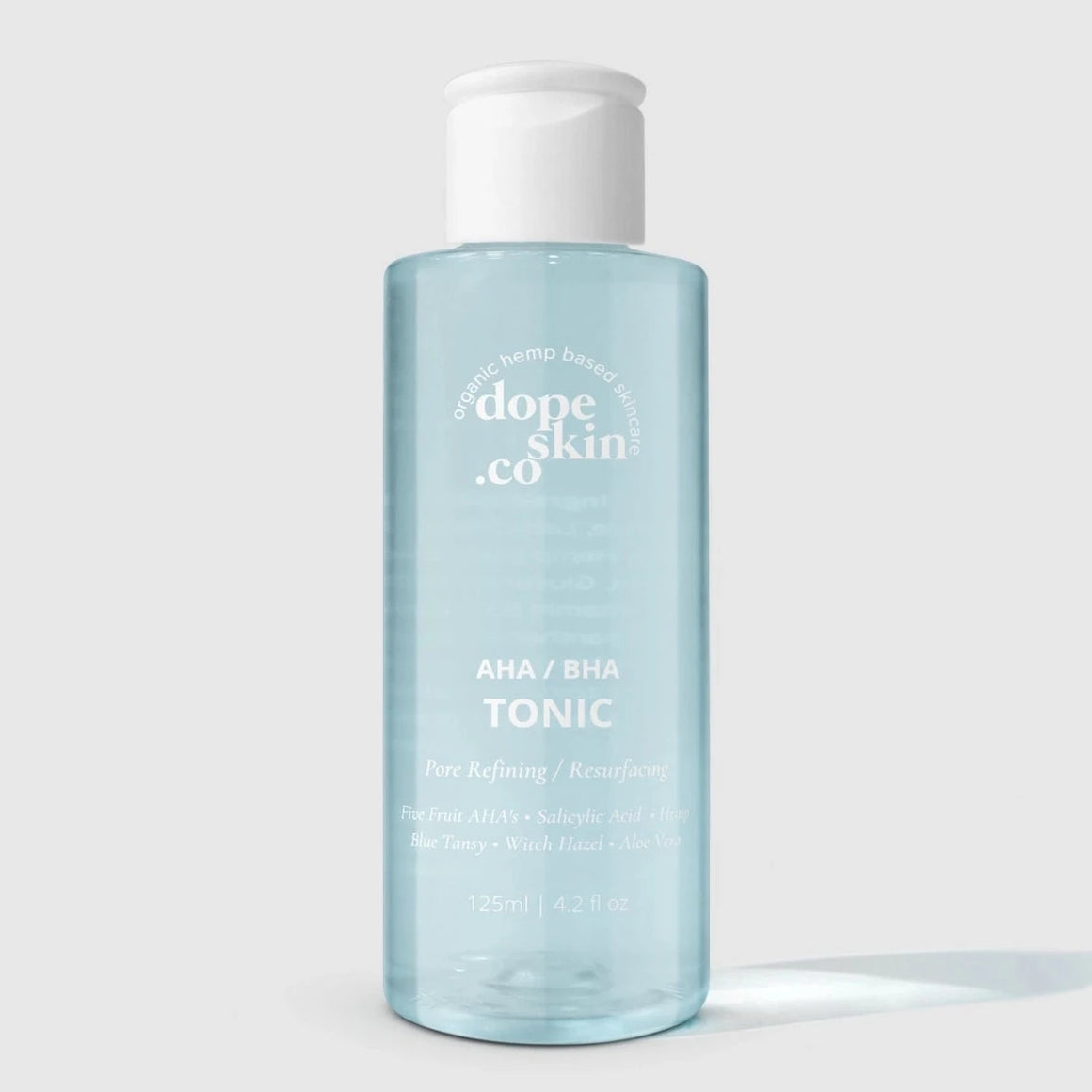 Bottle of 'dope skin co' AHA/BHA Tonic on a white background