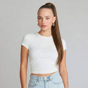 Model showcasing auburn brown ponytail hair extension with silky straight texture in a white top.