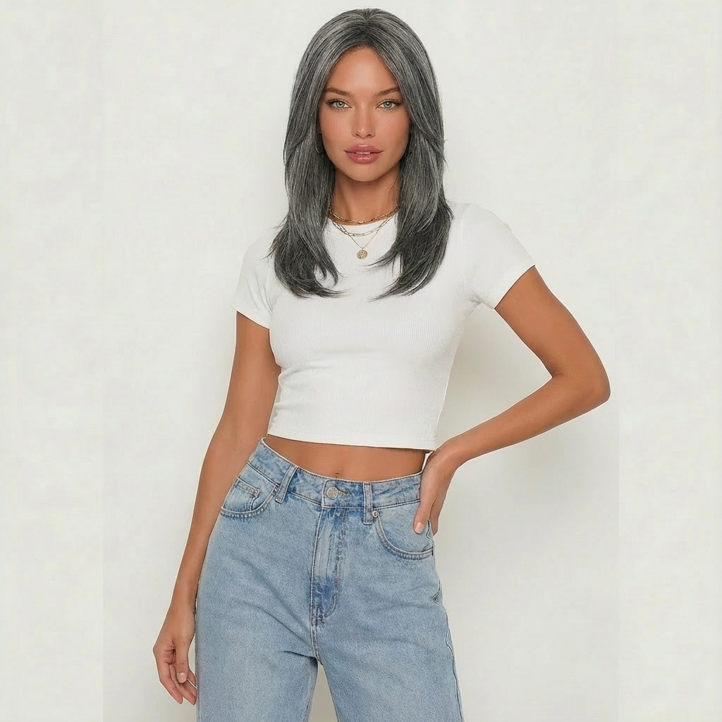 Dark grey layered wig modeled by a woman in a cropped white tee and high-waisted jeans, showcasing elegant style.