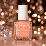 Zero nail polish bottle with a blurred festive background