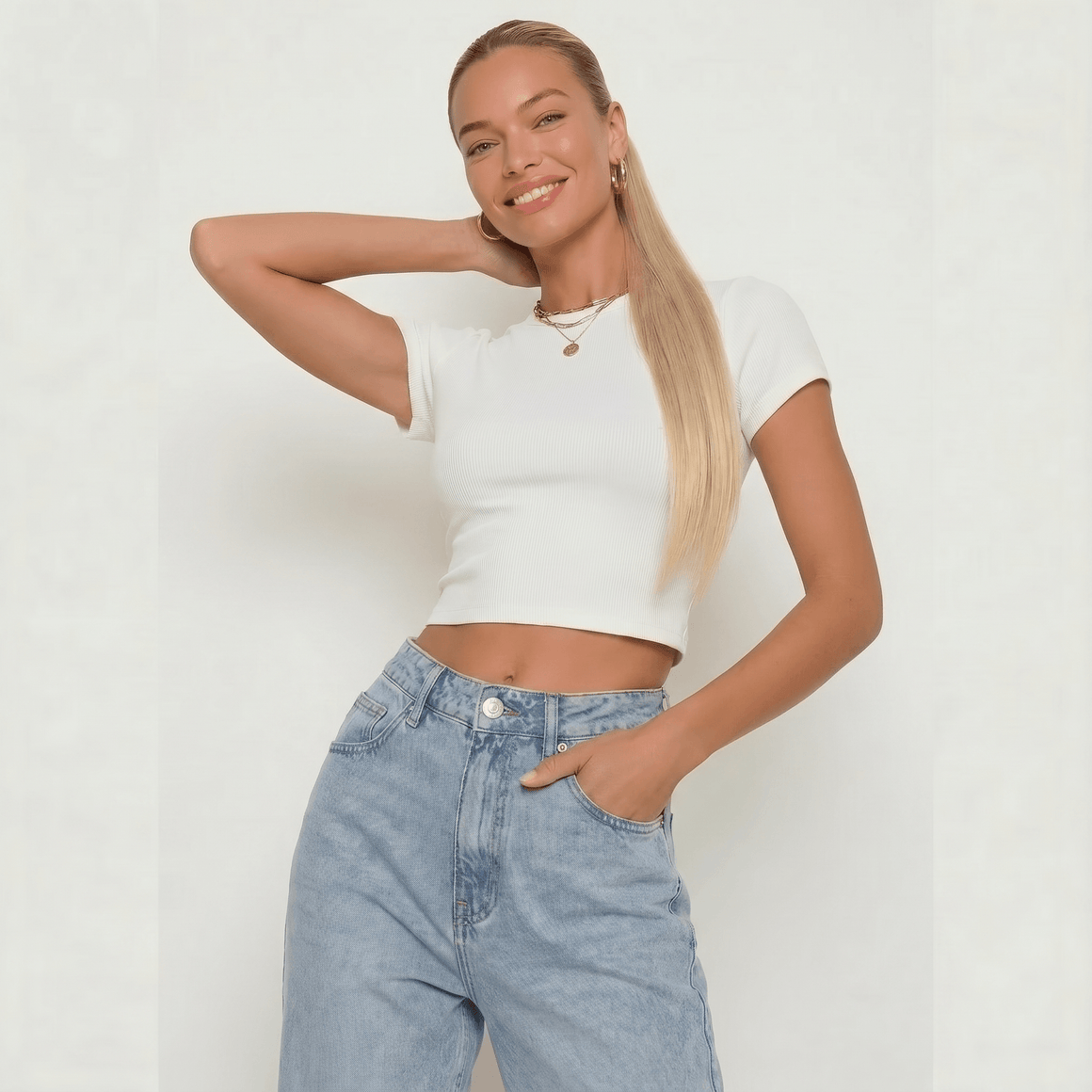 Model showcasing a stylish outfit with a silky straight buttery blonde ponytail hair extension.